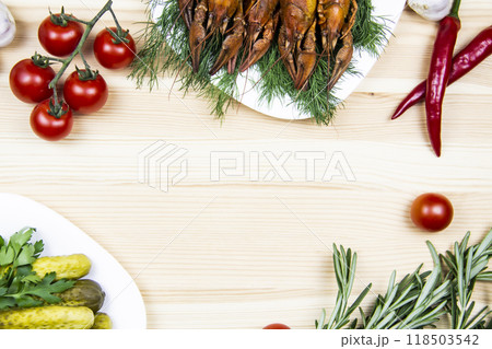 Composition with crayfish on the white plate, pepper, tomatoes, garlic, dill, parsley, pickled cucumbers, rosemary. Cooking food background with free space for text. Top view with copy space Composition with crayfish on the white plate, pepper, tomatoes, garlic, dill, parsley, pickled cucumbers, rosemary. Cooking food background with free space for text. Top view with copy space 118503542