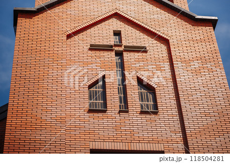 Large cross forming windows on modern church facade Large cross forming windows on modern church facade 118504281