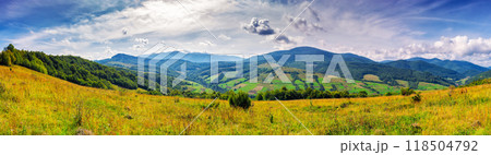 panorama of rural landscape in carpathian mountains in autumn. sunny day. grassy field and rolling hills. countryside scenery of ukraine. village in the distant valley panorama of rural landscape in carpathian mountains in autumn. sunny day. grassy field and rolling hills. countryside scenery of ukraine. village in the distant valley 118504792