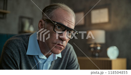 Portrait of senior military psychologist listening to patient, asking questions 118504855