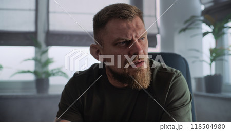 Close up of military man with PTSD crying, talking to psychotherapist Close up of military man with PTSD crying, talking to psychotherapist 118504980