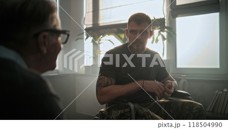 Military man with physical disability shakes hands with psychotherapist Military man with physical disability shakes hands with psychotherapist 118504990