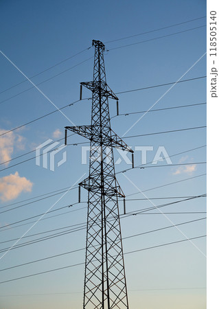 Power lines with wires on blue sky with clouds Power lines with wires on blue sky with clouds 118505140