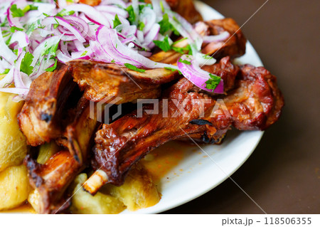 Grilled ribs with marinated onions and grilled vegetables. Grilled ribs with marinated onions and grilled vegetables. 118506355