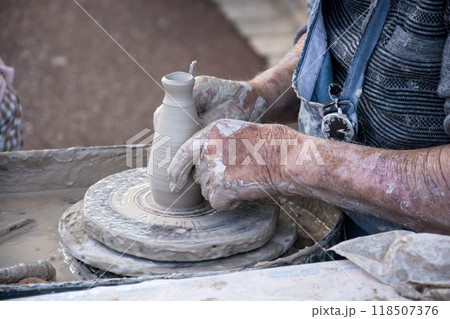 Closeup of hands of potter on ceramic Closeup of hands of potter on ceramic 118507376