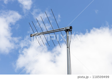 A television antenna on a residential house A television antenna on a residential house 118509499