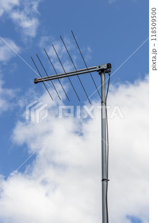 A television antenna on a residential house 118509500