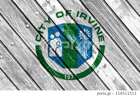 Flag of the city of Irvine, California, USA, on a background of a wooden fence. Conceptual collage Flag of the city of Irvine, California, USA, on a background of a wooden fence. Conceptual collage 118511511