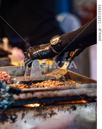 Chef Cooking Food on a Flat-Top Grill Chef Cooking Food on a Flat-Top Grill 118513301