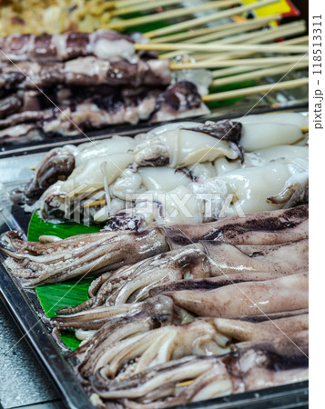 Fresh Squid Skewers at a Market Stall Fresh Squid Skewers at a Market Stall 118513311