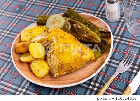 Delicious chicken thighs with stewed peppers and boiled potatoes Delicious chicken thighs with stewed peppers and boiled potatoes 118514618