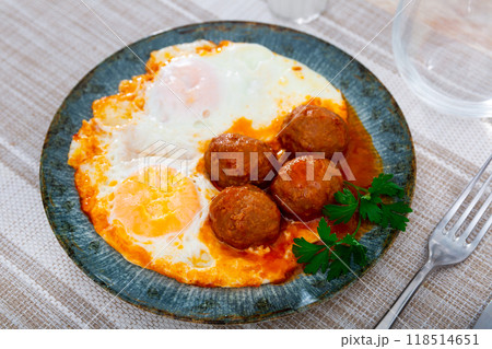 Smoked Spanish albondigas, meatballs cooked with scrambled eggs Smoked Spanish albondigas, meatballs cooked with scrambled eggs 118514651