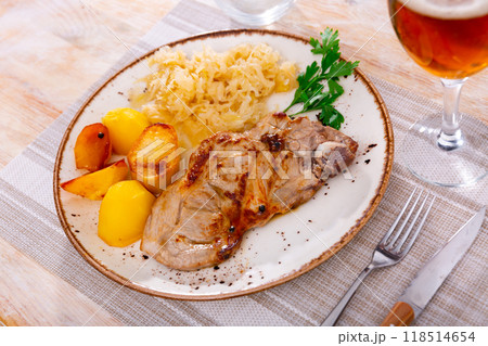 Pork served with pickled cabbage and potatoes Pork served with pickled cabbage and potatoes 118514654