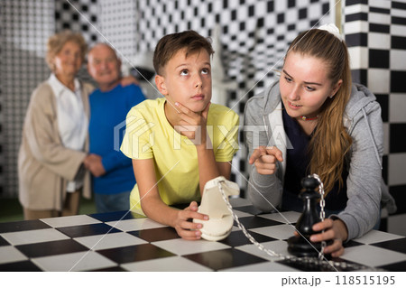 Exciting adventure for positive teenagers in chess room Exciting adventure for positive teenagers in chess room 118515195
