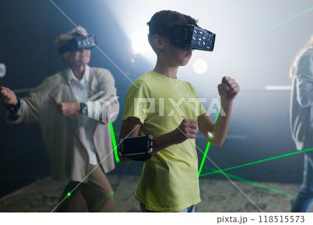 Family using virtual reality glasses delighted with videogames Family using virtual reality glasses delighted with videogames 118515573
