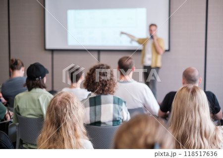 Audience listening to speaker during business presentation in conference room 118517636