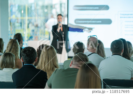 Business conference with speaker presenting to audience Business conference with speaker presenting to audience 118517695