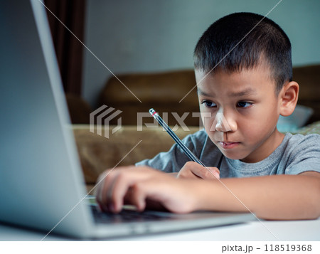 Technology studying at home using laptop computer, Student distance learning virtual distance online class on video call virtual lesson, Parent or tutor teaching child boy with remote education. 118519368