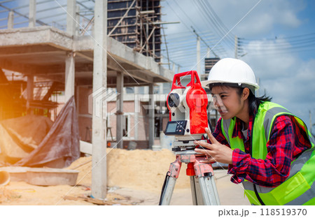 Surveyor and survey equipment on construction site, Land and soil development, Survey equipment, Theodolite for measurement construction work, Civil engineer or Architect working surveyor. 118519370