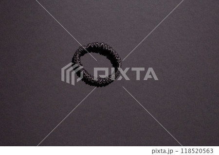 Hair scrunchie for women, crafted from natural materials in a solid color design. Versatile and stylish accessory for various hairstyles 118520563