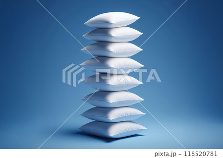 White pillows stacked against a blue background, with several floating above the stack. The image creates a gravity defying illusion, making pillows appear suspended in mid air, 118520781