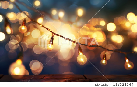Glowing garland with light bulbs, defocused bokeh background. Festive illuminating decoration 118521544