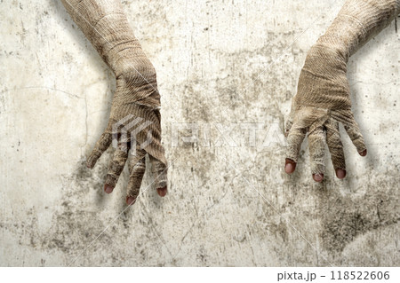 Mummy hands have dirty bandages on them. Mummy, devil, evil, satan or zombie hands 118522606