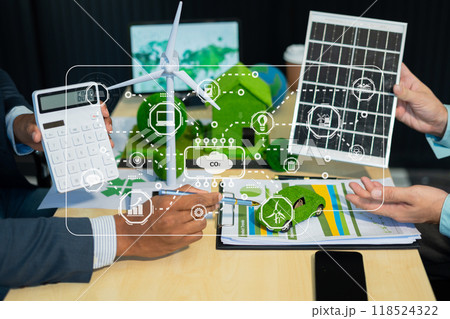 Holding a light bulb against nature on green leaf with energy source icon for renewable and sustainable development, ecology concept. Holding a light bulb against nature on green leaf with energy source icon for renewable and sustainable development, ecology concept. 118524322