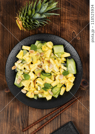 Delicious ananas and cucumber salad. 118525934