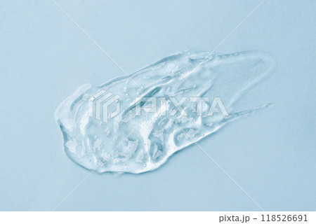 Transparent Skin care Product Smear on Blue Background Transparent Skin care Product Smear on Blue Background 118526691