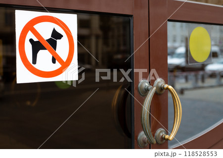 Sign prohibiting entry to an establishment with dog, sticker prohibiting entry with pet, badge with dog crossed out in red on door, icon ban with animals with crossed out silhouette of dog Sign prohibiting entry to an establishment with dog, sticker prohibiting entry with pet, badge with dog crossed out in red on door, icon ban with animals with crossed out silhouette of dog 118528553