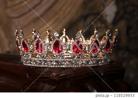 Royal crown with red ruby gemstones 118529933