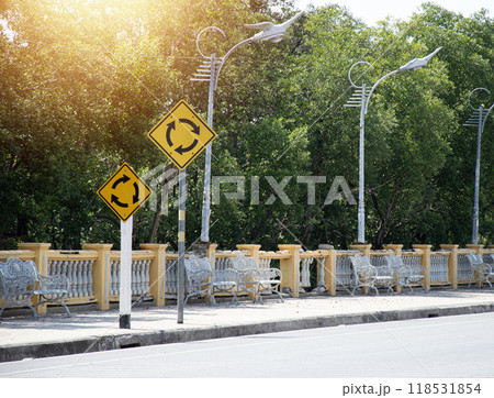 Traffic sign showing a roundabout ahead Traffic sign showing a roundabout ahead 118531854