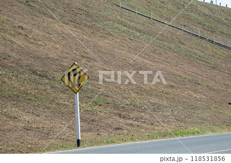 Traffic signs indicate left and right intersections ahead. Traffic signs indicate left and right intersections ahead. 118531856
