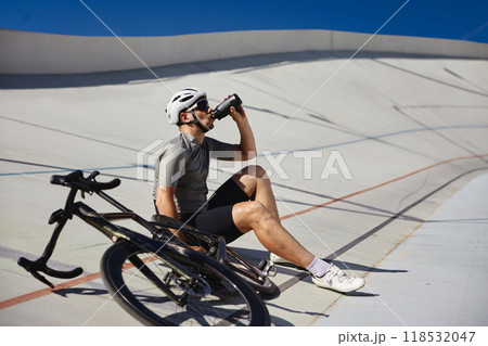 Happy tired sportsman resting enjoying refreshing time during cycling training 118532047
