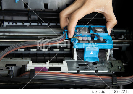 Technician repairing printer, fixing printer head 118532212