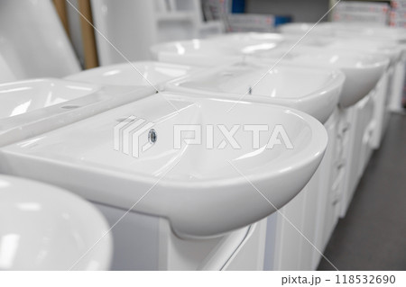 Modern classic ceramic sink assortment at plumbing shop closeup selective focus Modern classic ceramic sink assortment at plumbing shop closeup selective focus 118532690