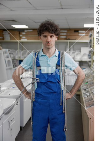 Portrait with vertical view of plumber shopping at plumbing store Portrait with vertical view of plumber shopping at plumbing store 118532691