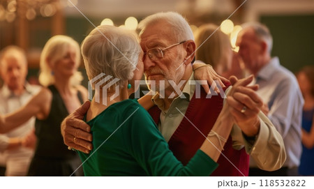 Romantic senior couple dancing together at dance hall Romantic senior couple dancing together at dance hall 118532822