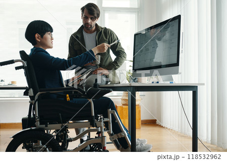 Colleagues Discussing Timetable On Computer Colleagues Discussing Timetable On Computer 118532962