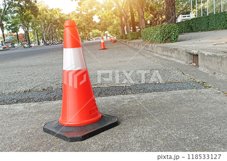 Traffic cones are in working condition. placed on the road surface 118533127