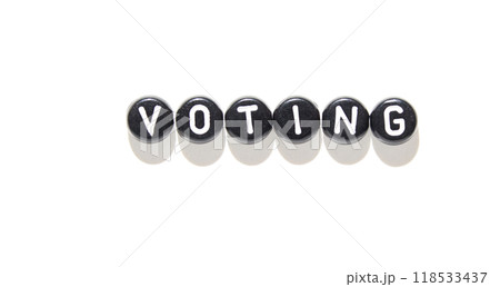 Black and white voting concept with word formed by letter blocks on bright 118533437