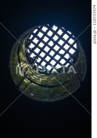 view from the dungeon upwards through a hatch covered with a grate view from the dungeon upwards through a hatch covered with a grate 118533474