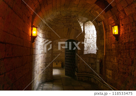 underground passage, tunnel in an ancient castle 118533475