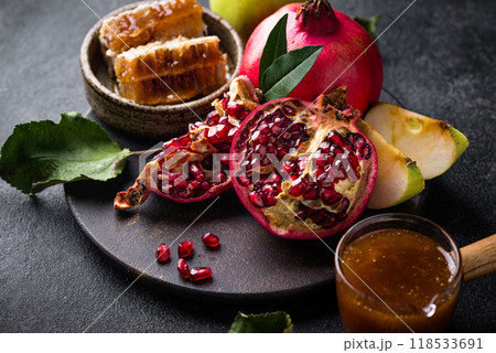 Rosh Hashana concept with honey, apple and pomegranate Rosh Hashana concept with honey, apple and pomegranate 118533691