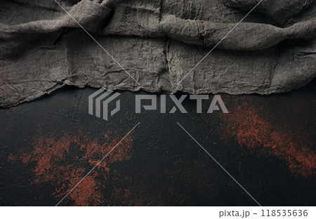 Black gauze kitchen towel on black brown surface, top view. Copy space 118535636