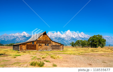 Iconic view of Grand Teton National Park with T. A. Moulton Barn in the Mormon Row Historic District - Wyoming, United States 118535677