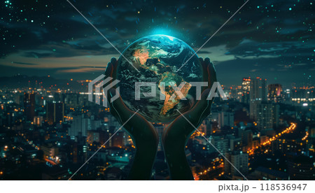 Man Holding The Earth Against A Cityscape At Night: A Symbolic Image Representing Business, Politics, Ecology, And Media. Abstract Earth Day Background 118536947