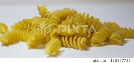 Very close up picture of Rotini corkscrew pasta isolated on white background 118537752