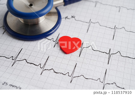 Stethoscope on electrocardiogram (ECG), heart wave, heart attack, cardiogram report. Stethoscope on electrocardiogram (ECG), heart wave, heart attack, cardiogram report. 118537910